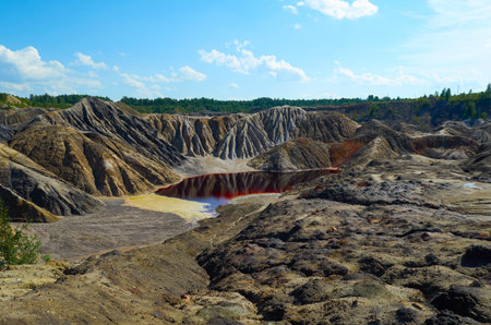 mountains of red clay in the Urals. The color of iron and the atmosphere of Mars. Unusual terrain....