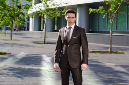 a young businessman in a summer metropolis.の写真素材