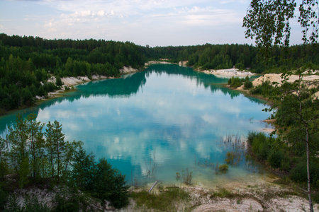 kaolin quarry with turquoise water and white clay
