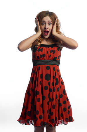 a girl in a red dress on a white background.fun and emotionsの写真素材
