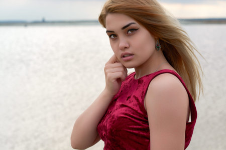 beautiful girl near the lake at sunset.