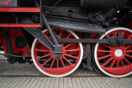 red and black retro train wheels close up