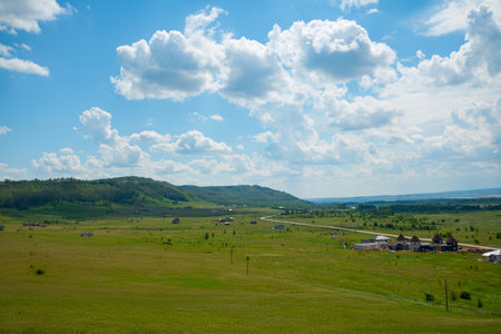 landscape with cows and clouds