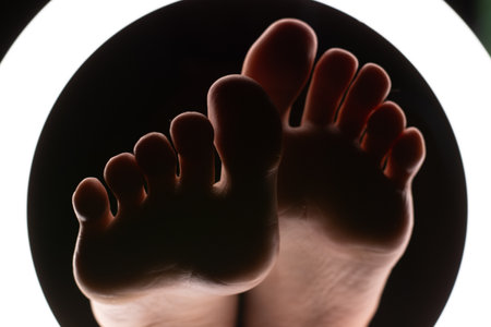 female legs close-up in a round lamp.the concept of hygiene and care.の写真素材