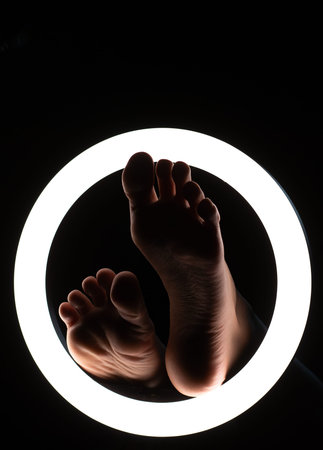 female legs close-up in a round lamp.the concept of hygiene and care.