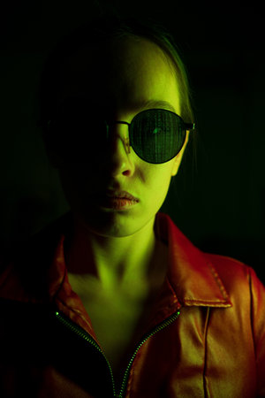 portrait of a girl in the matrix style.red and green shadesの写真素材