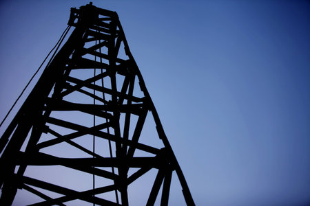 Black shadow construction cranes with blue sky background , silhouette