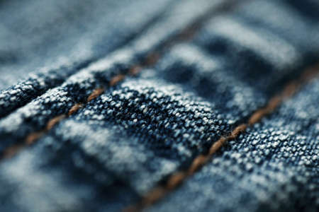 Jeans denim texture close up , focus only one point , soft blured background wallpaperの写真素材
