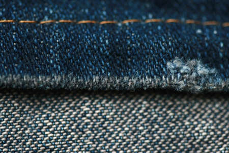 Jeans denim texture close up , focus only one point , soft blured background wallpaperの写真素材