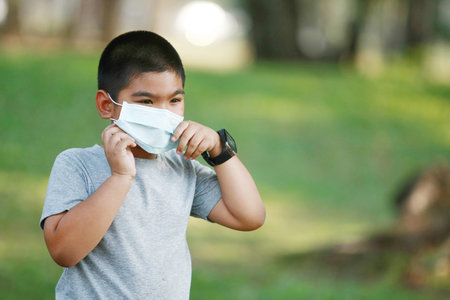 A young Asian boy wear mask to protect Covid-19の写真素材