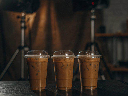 Ice coffee in the glass with ice frozen on black backgroundの素材