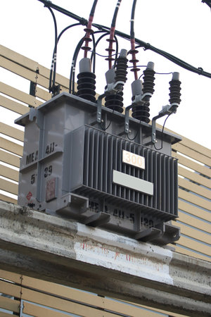 High voltage electric transformer on the roof of the building, Thailand.