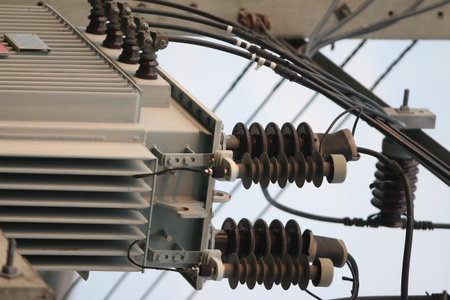 Electrical equipment. High voltage power transformer. Close-up.