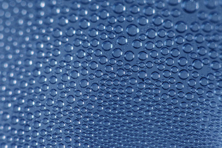 Water drops on blue background. Water drops texture. Water drops patternの写真素材