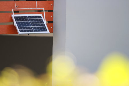 Solar panel installed on the wall of a building. Alternative energy source.の写真素材