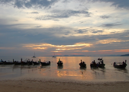 Boats on a beach in Krabi, Thailand の写真素材