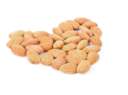 Almonds isolated on white backgroundの写真素材