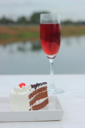 Cakes and red wine の写真素材