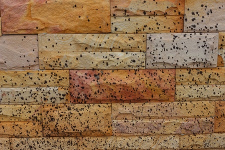 Brick wall with black dots の写真素材