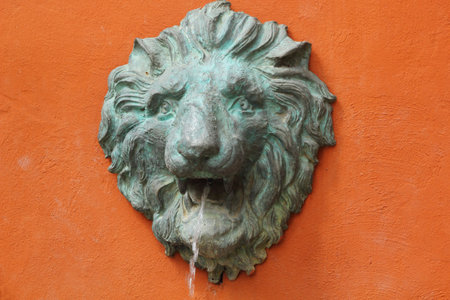 Lion sculptures spraying water.の写真素材