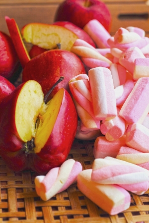 Fruit apple red with pink marshmellows.の写真素材