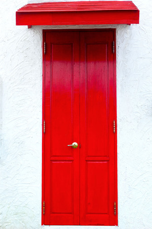 Red wooden door - Vintage style の写真素材