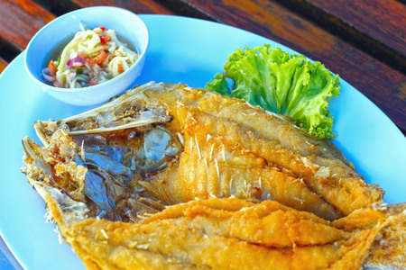 Fried fish with mango salad.の写真素材
