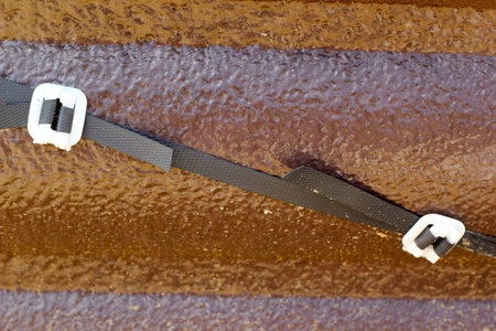 Brown tiles with straps.