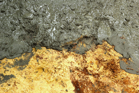 Pouring concrete mix for road construction 
