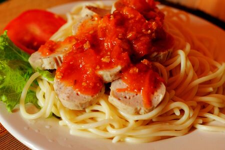 Spaghetti - with sauce in the plate.の写真素材