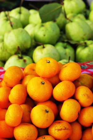 orange fruit  and guava fruit in the marketの写真素材