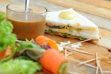 Tuna sandwich with salad vegetables and coffeeの写真素材