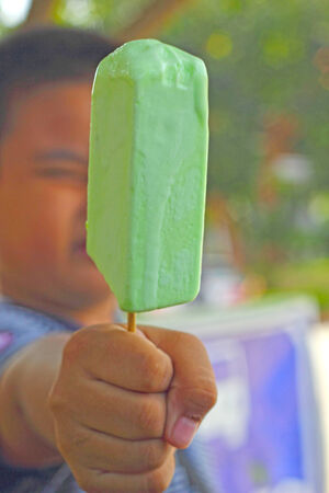 Children eating ice cream traditional Thailand.の写真素材
