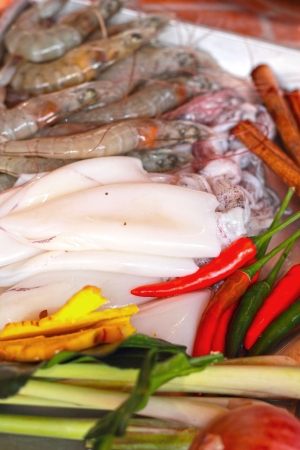 Fresh squid and fresh shrimp with garnish for soup.の写真素材