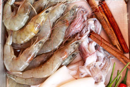 Fresh squid and fresh shrimp with garnish for soup.の写真素材