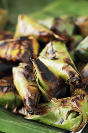 Sticky rice wrapped in banana leaves grillの写真素材