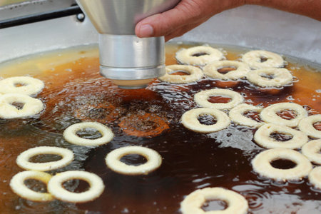 making donut fried in a pan