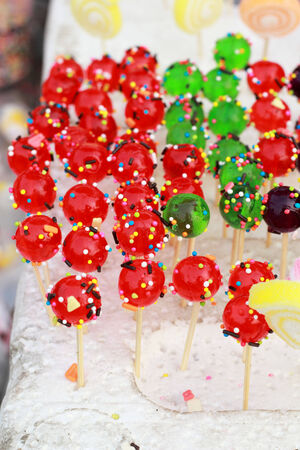 colored candies arranged in a row.の写真素材