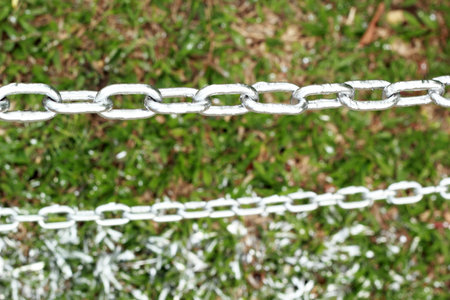 Pole chain on the grass.