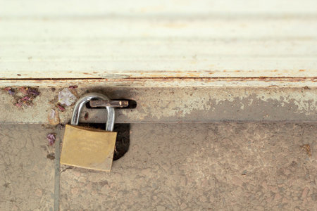 Old padlock on a steel door