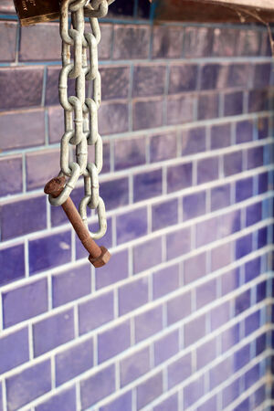 Padlock with chain on the hex nutの写真素材
