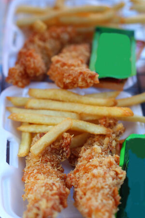 French fries and fried chicken in the market.の写真素材