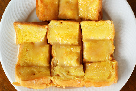 Toast with butter and sprinkling with sugar.
