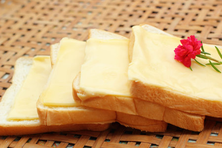 cheese the place on a slice of bread.の写真素材