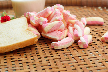 fresh milk and pink marshmallows with a slice of bread.の写真素材
