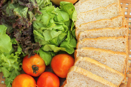 Fresh vegetables salad with whole wheat bread.の写真素材