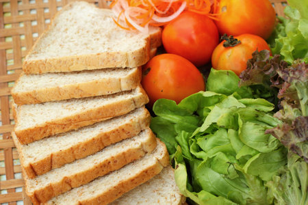 Fresh vegetables salad with whole wheat bread.