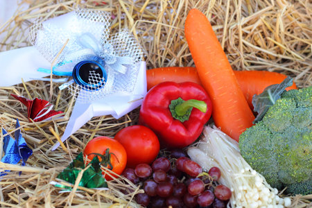 Fresh vegetables  broccoli and grapes on straw.の写真素材