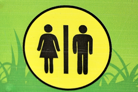 Symbolize toilets on green backgroundの写真素材