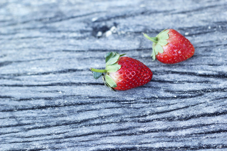 fresh strawberry fruit on wooden floorの写真素材